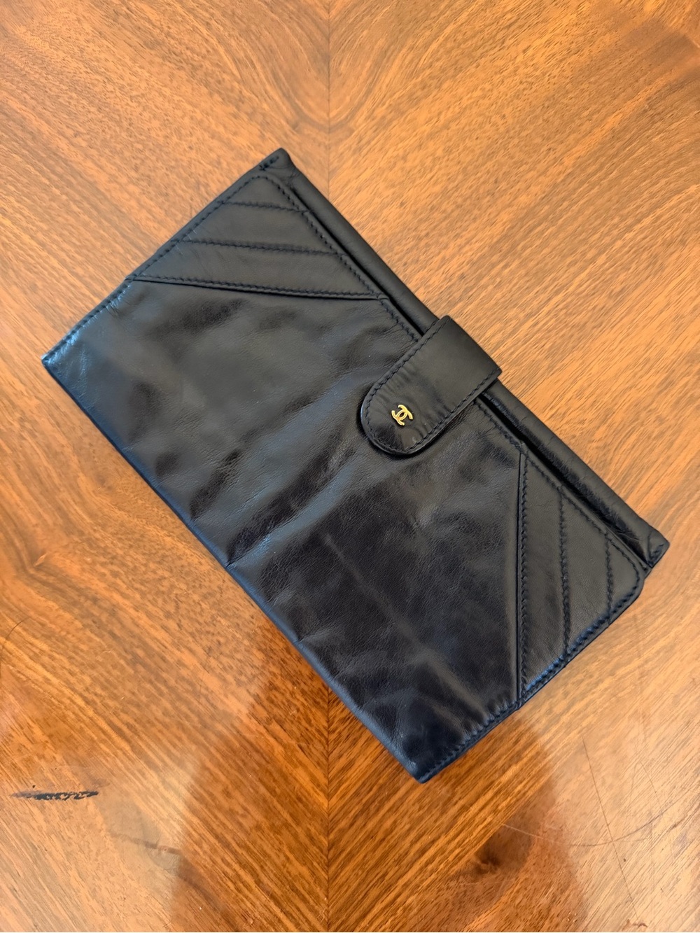 Vintage Chanel Black Leather Wallet with Gold Accent and Red Interior